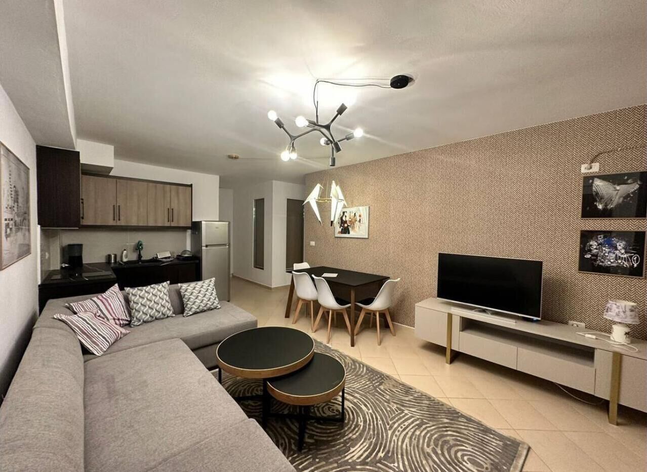 Family Apartment, City View | Living area | Flat-screen TV
