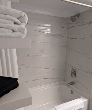 Economy Room, Harbor View | Bathroom | Combined shower/tub, hair dryer, towels