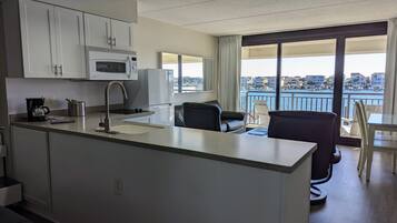Economy Room, Harbor View | Private kitchen | Stovetop, dishwasher, coffee/tea maker, toaster
