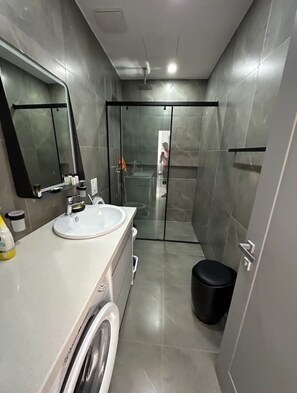 Hair dryer, slippers, towels, toilet paper