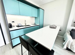 Fridge, stovetop, electric kettle, toaster