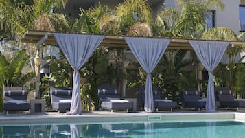 Outdoor pool, open 10:00 AM to 9:00 PM, pool umbrellas, sun loungers