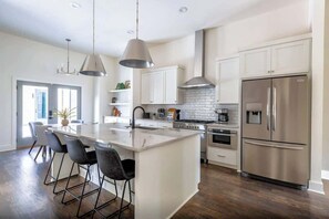 Fridge, microwave, oven, stovetop - 2 West End Homes • Patios • Perfect Group Stay (Nashville)