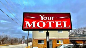 A motel sign with the text "Your MOTEL" and a house number "829" in the background. - Your Motel (Ypsilanti)