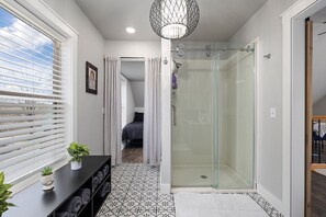 Shower, hair dryer, towels, soap