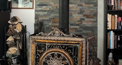 Warm cozy country cottage nestled beneath the mountains, woodstove, Catskill