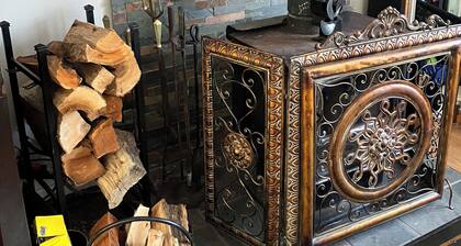 Warm cozy country cottage nestled beneath the mountains, woodstove, Catskill