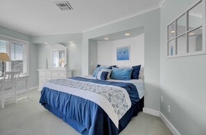 1 habitación y tabla de planchar con plancha