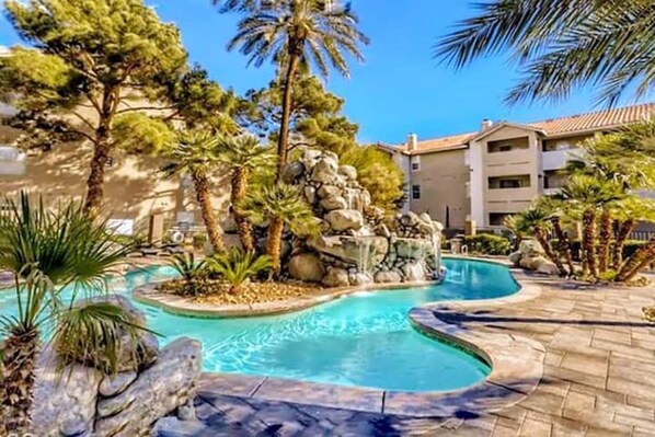 Outdoor pool, a heated pool - Upgraded Tropical Oasis! Heated Pool, Spa & Gym, Walk to Strip! (Las Vegas)