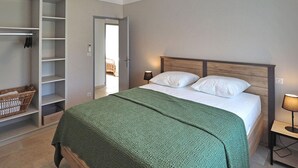 A bedroom with a bed, a wardrobe, and a nightstand. - Pet friendly home in Moulès (Moulès)