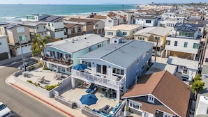 A coastal residential area with houses featuring balconies and patios.
