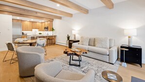 A modern living room with a sofa, chairs, a coffee table, and a dining area with a table and chairs. - Riverside Getaway | Walk to Main St, Festival & Ski Fun (Telluride)