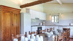A dining area with a wooden table set for four, surrounded by wooden chairs. - Beautiful home in Lamonzie Montastruc (Lamonzie Montastruc)