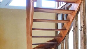 A wooden staircase with a simple design and metal hooks on the wall. - Beautiful home in Lamonzie Montastruc (Lamonzie Montastruc)