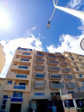 Stunning multi-story building with spacious balconies and a welcoming entrance.