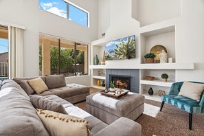 Smart TV, fireplace, books, offices