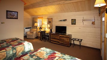 Deluxe Cabin | Living area | 32-inch flat-screen TV with satellite channels