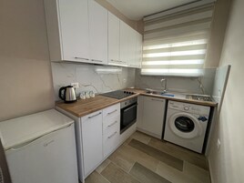 Studio – deluxe | Oppholdsområde | Flatskjerm-TV