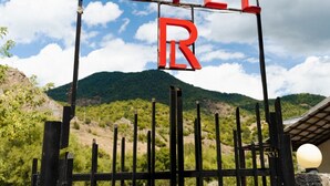 A sign with the word "HOTEL" and a large "R" indicating a hotel room. - Restland Dilijan Family Hotel  (Dilijan)