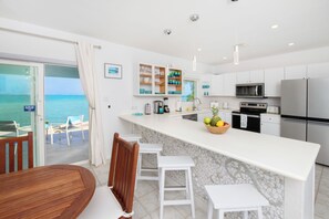 Fridge, microwave, oven, stovetop - Blue Moon: Upgraded Cottage w/Sandy Beach + Backyard Snorkeling Next to Ocean Frontiers (Gun Bay)
