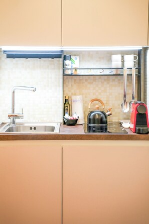 Fridge, stovetop, coffee/tea maker, cookware/dishes/utensils