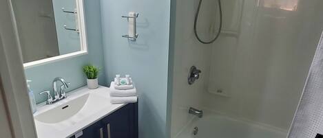 Hair dryer, towels, soap, shampoo