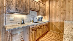 A kitchen with wooden cabinets, granite countertops, and a built-in dishwasher. - Sunglow Mt Vista - Pet friendly-Mountain View- Hottub-  (Cherrylog)