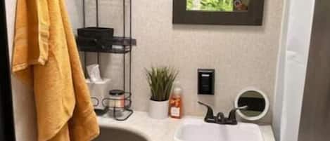 Shower, hair dryer, towels, soap