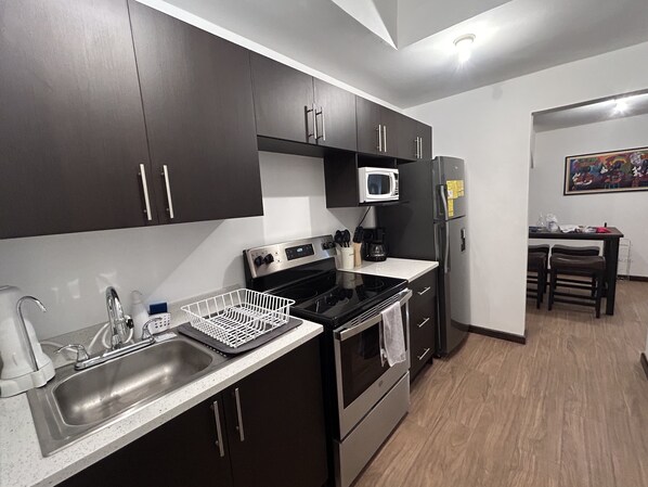 Fridge, microwave, stovetop, coffee/tea maker