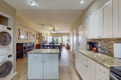 Waterfront community condo with on-site pool, water views, & private patio