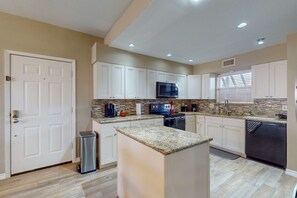 Fridge, microwave, oven, stovetop - Waterfront community condo with on-site pool, water views, & private patio (Seabrook)