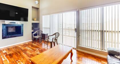 3rd-floor condo with water views, on-site pool, & private balcony