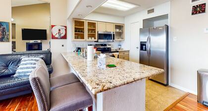 3rd-floor condo with water views, on-site pool, & private balcony