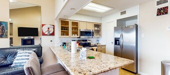 3rd-floor condo with water views, on-site pool, & private balcony