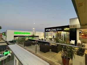 A commercial area with a 'Mercadona' store and a 'Bayside Chillout Garden' restaurant. - not available (Torrevieja)