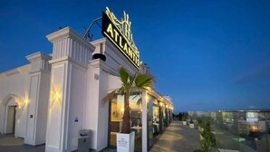 A hotel exterior with a prominent sign reading "ATLANTIS." - Hotel Atlantis Alger (Algiers)