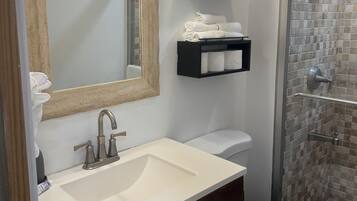 Shower, hair dryer, towels, soap