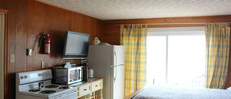 Luxury Studio | Living area | 32-inch LCD TV with cable channels