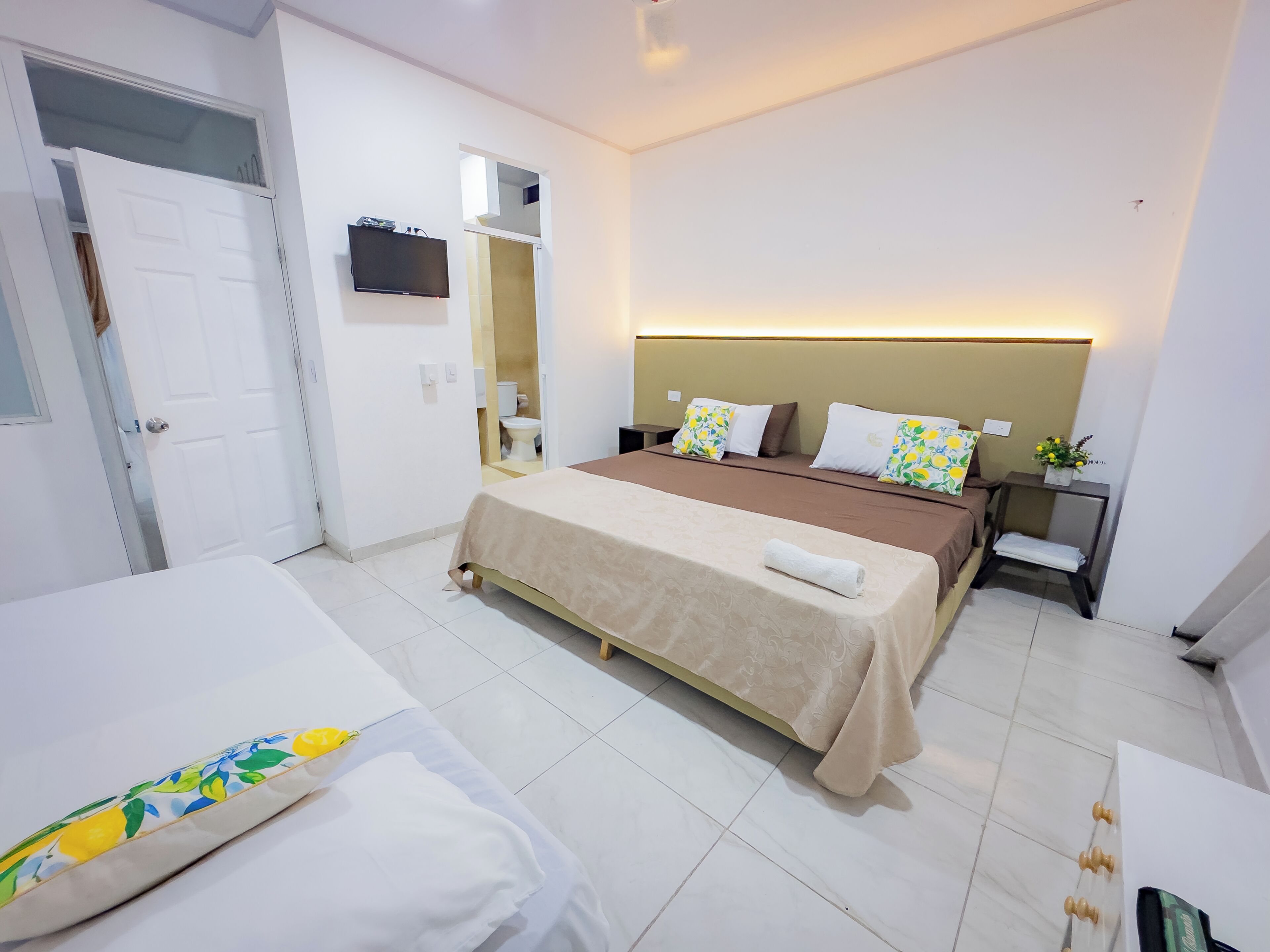Family Triple Room, Courtyard View | Down comforters, individually decorated, individually furnished