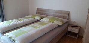 2 bedrooms, travel crib, WiFi, bed sheets