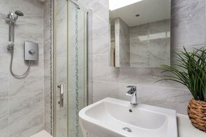 Shower, hair dryer, towels, soap