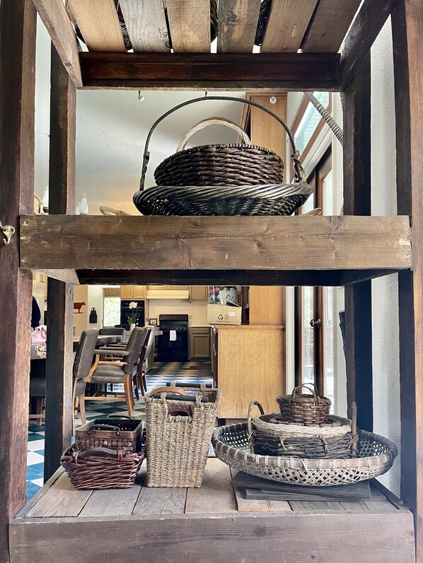 A rustic wooden structure with woven baskets and a woven tray hanging from the ceiling. - Spacious 5-bedroom Lodge nestled at the Gateway to the Sequoias. (Three Rivers)