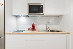 Microwave, stovetop, coffee/tea maker, blender