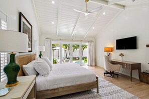 A bedroom with a bed, desk, chair, and a TV. - 4 Bedrooms, Steps to the Intracoastal (West Palm Beach)
