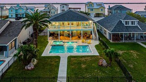 A residential property with a swimming pool, a covered patio, and a view of the water. - Copano Bay, Rockport, Tx. Waterfront, Private Pool & Hot Tub, & Pier  (Rockport)