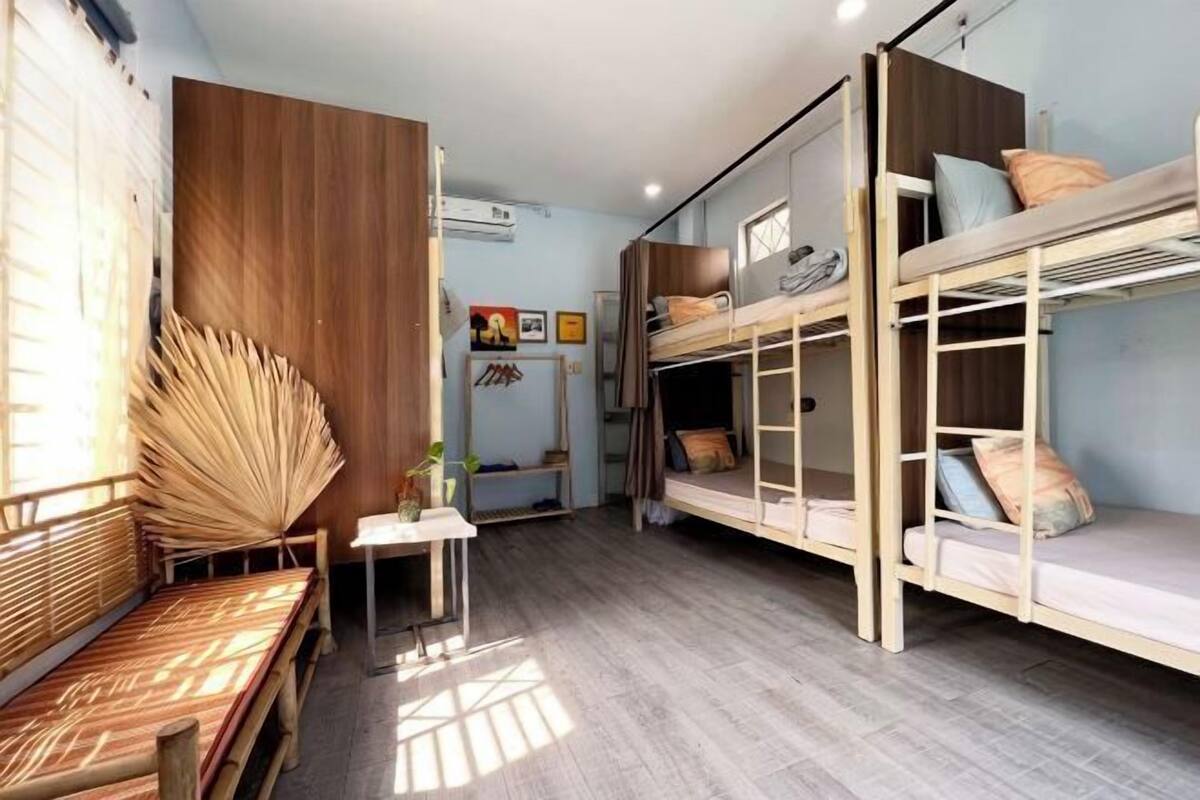 Premium bedding, desk, laptop workspace, blackout drapes