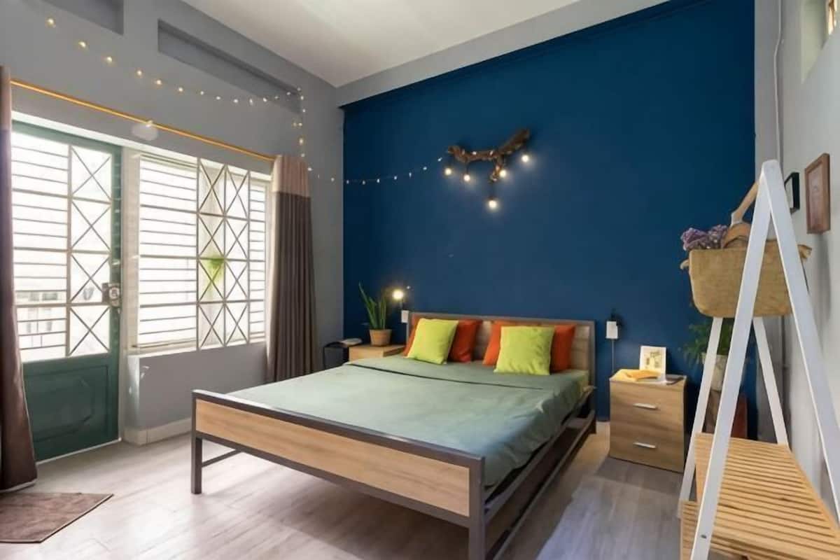 Premium bedding, desk, laptop workspace, blackout drapes