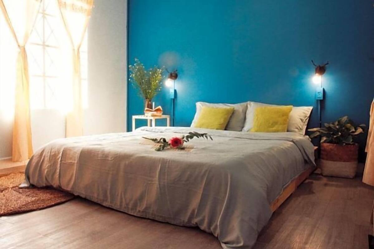 Premium bedding, desk, laptop workspace, blackout drapes