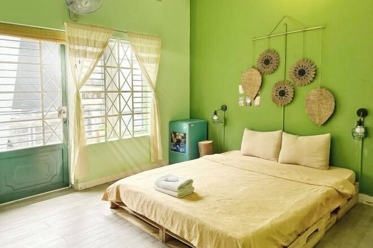Premium bedding, desk, laptop workspace, blackout drapes