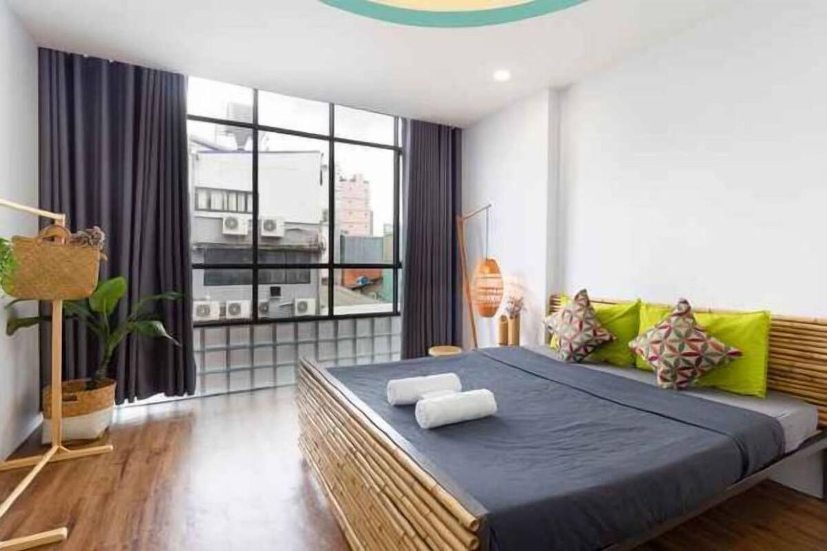 Premium bedding, desk, laptop workspace, blackout drapes